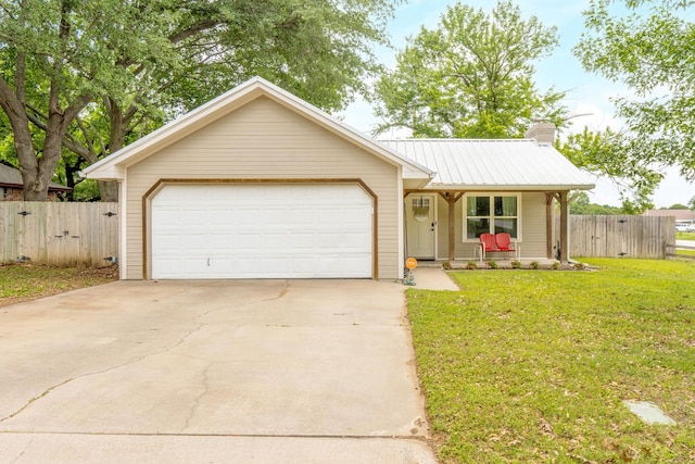 ranch-style home with covered porch, fence, metal roof, and a front lawn