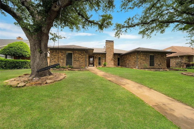 2227 Timberwood, Carrollton, TX 75006 - single story home featuring brick siding, a chimney, and a front yard