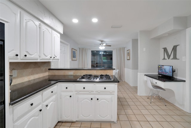 2227 Timberwood, Carrollton, TX 75006 - kitchen featuring stainless steel gas stovetop, ceiling fan, a peninsula, dark countertops, and white cabinets