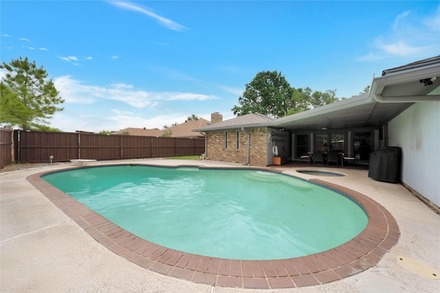 2227 Timberwood, Carrollton, TX 75006 - view of pool with an in ground hot tub, a fenced in pool, and a fenced backyard