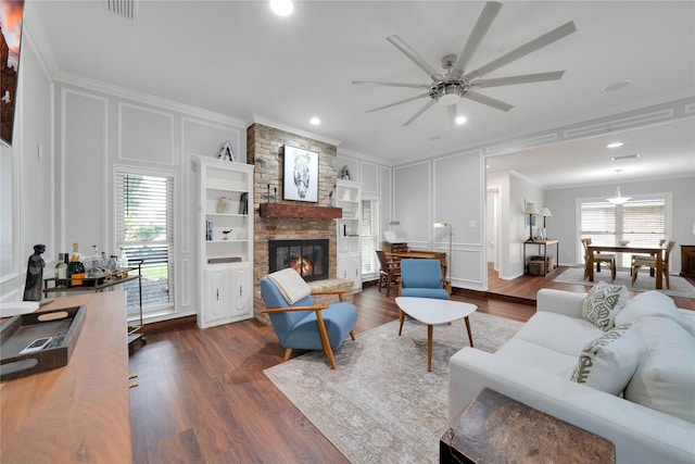 2227 Timberwood, Carrollton, TX 75006 - living area featuring ornamental molding, a decorative wall, visible vents, and wood finished floors