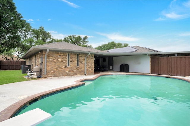 2227 Timberwood, Carrollton, TX 75006 - view of pool with a patio, cooling unit, a diving board, fence, and a fenced in pool