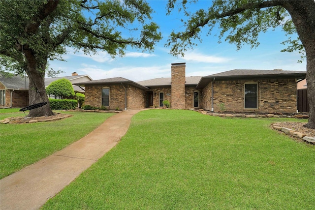 2227 Timberwood, Carrollton, TX 75006 - ranch-style home featuring brick siding, a front lawn, and a chimney