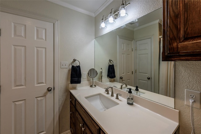 5921 Springbrook Dr, Tyler, TX 75707 - bathroom with visible vents, vanity, crown molding, and a textured wall