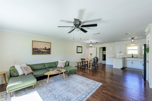 5921 Springbrook Dr, Tyler, TX 75707 - living area featuring crown molding, visible vents, dark wood-style flooring, and ceiling fan