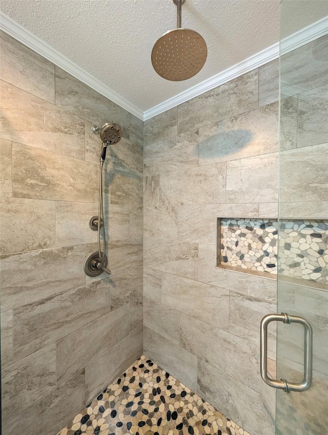 5921 Springbrook Dr, Tyler, TX 75707 - full bathroom with a stall shower, ornamental molding, and a textured ceiling