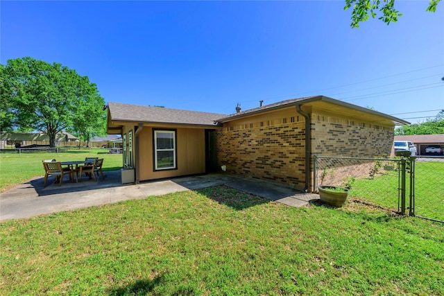 5921 Springbrook Dr, Tyler, TX 75707 - exterior space featuring brick siding, a yard, fence, and a patio area