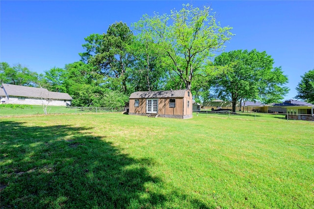5921 Springbrook Dr, Tyler, TX 75707 - view of yard featuring an outdoor structure and a fenced backyard