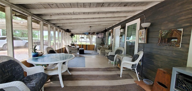 sunroom with beam ceiling