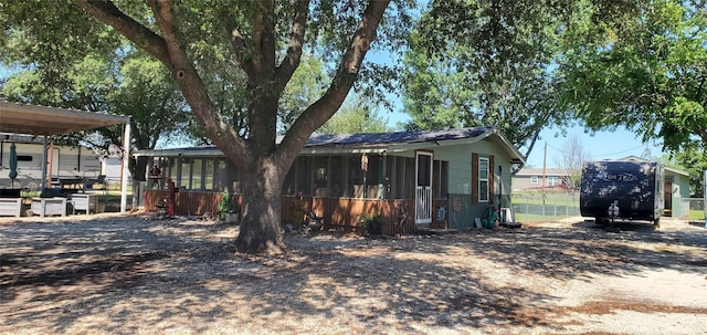 view of home's exterior with an outbuilding