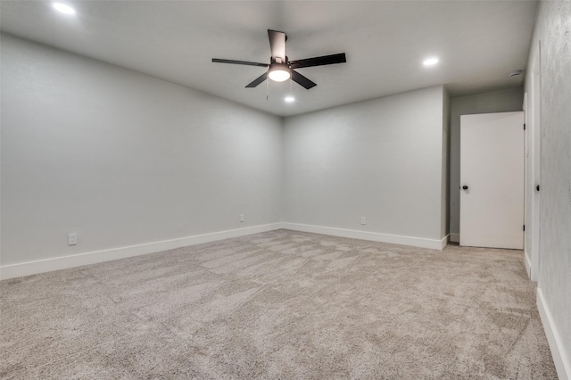 unfurnished room featuring ceiling fan, light carpet, baseboards, and recessed lighting