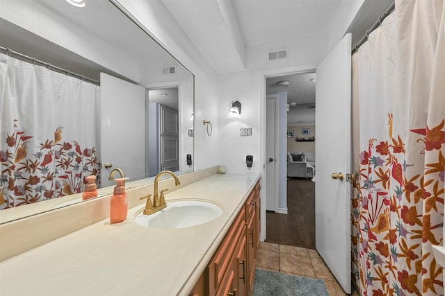 bathroom featuring vanity, visible vents, and tile patterned flooring