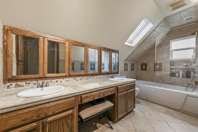 full bath featuring vaulted ceiling with skylight, toilet, a sink, and double vanity