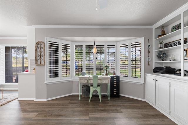 1105 Charles St, Weatherford, TX 76086 - dining area featuring crown molding, a textured ceiling, dark wood finished floors, and baseboards