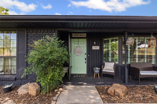 1105 Charles St, Weatherford, TX 76086 - ranch-style house featuring brick siding, roof with shingles, and a patio