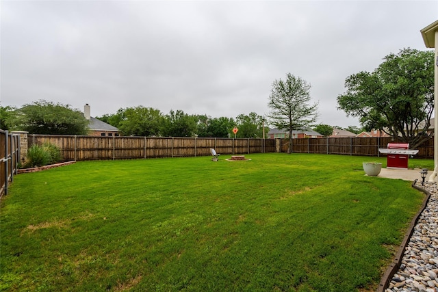 view of yard with a fenced backyard
