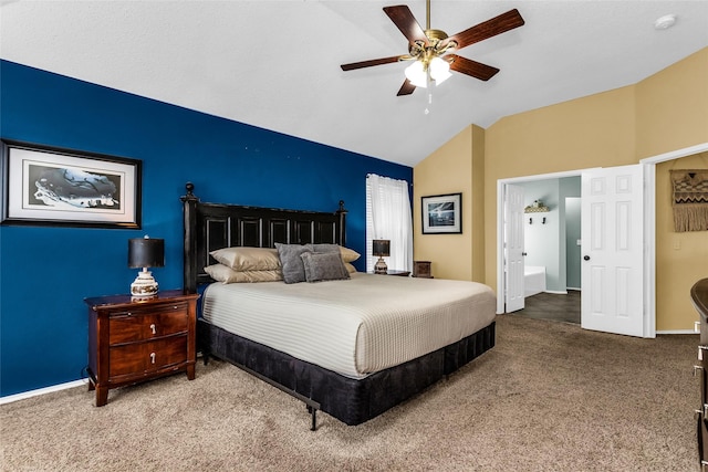 carpeted bedroom with vaulted ceiling, ceiling fan, connected bathroom, and baseboards