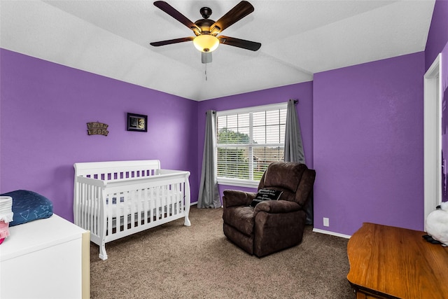 carpeted bedroom with vaulted ceiling, baseboards, and a ceiling fan