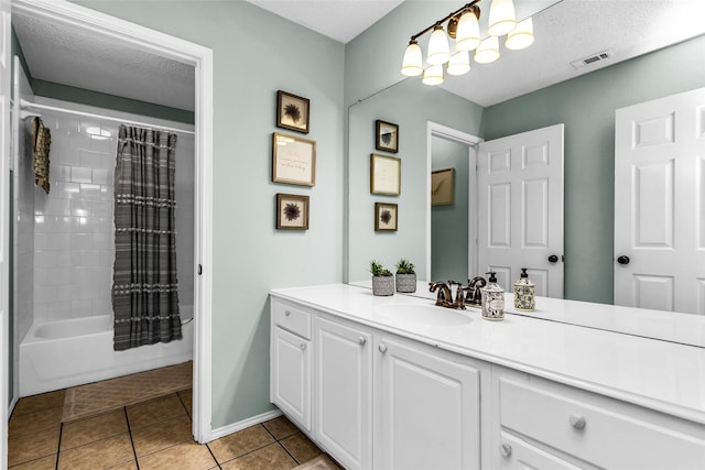 bathroom featuring an inviting chandelier, visible vents, tile patterned floors, vanity, and shower / bath combo