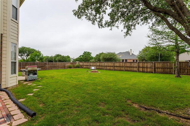 view of yard with a fenced backyard