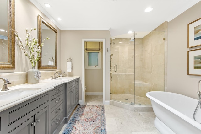 full bath with a stall shower, toilet, a freestanding bath, and a sink