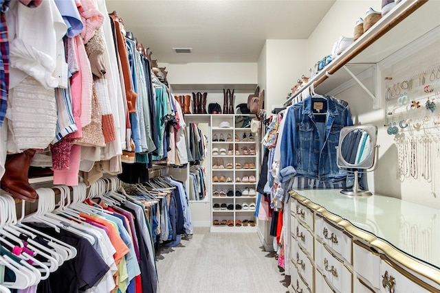 spacious closet featuring carpet flooring and visible vents