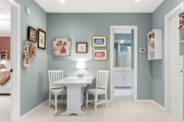 dining room featuring carpet floors, baseboards, and recessed lighting