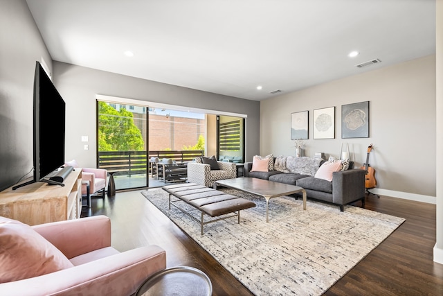 living room with wood finished floors, recessed lighting, and baseboards