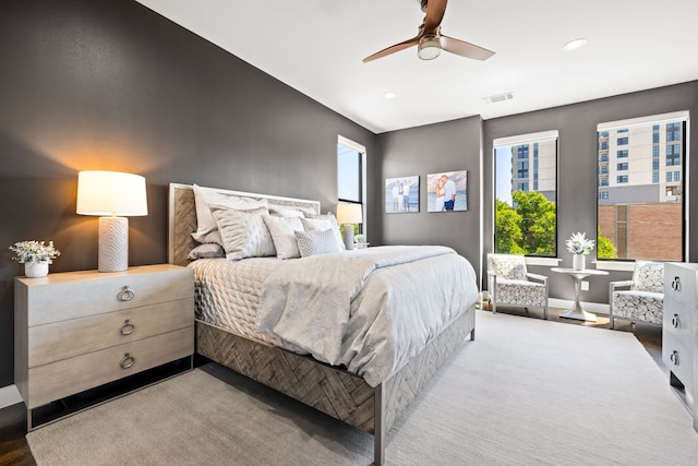 bedroom with multiple windows, recessed lighting, ceiling fan, and baseboards