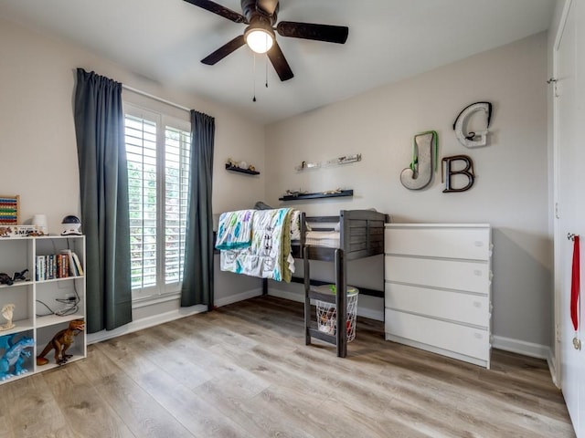 17607 Seedling Ct, Dallas, TX 75287 - bedroom with wood finished floors, multiple windows, and baseboards