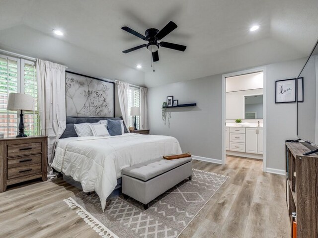17607 Seedling Ct, Dallas, TX 75287 - bedroom with multiple windows, light wood-style floors, ensuite bathroom, recessed lighting, and baseboards