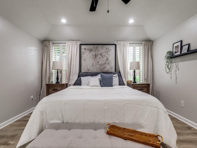 17607 Seedling Ct, Dallas, TX 75287 - bedroom with vaulted ceiling, dark wood-style flooring, multiple windows, baseboards, and a ceiling fan