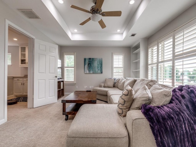 17607 Seedling Ct, Dallas, TX 75287 - living area with a ceiling fan, recessed lighting, a tray ceiling, light colored carpet, and baseboards