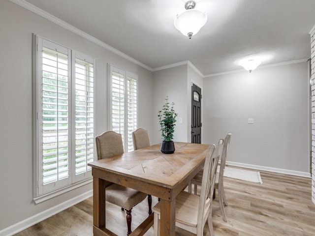 17607 Seedling Ct, Dallas, TX 75287 - dining room with baseboards, light wood-style flooring, and ornamental molding
