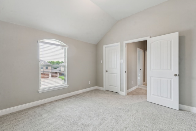 1261 Altuda Dr, Forney, TX 75126 - unfurnished bedroom featuring baseboards, carpet floors, and vaulted ceiling