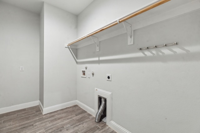 1261 Altuda Dr, Forney, TX 75126 - clothes washing area featuring wood finished floors, laundry area, washer hookup, hookup for an electric dryer, and hookup for a gas dryer
