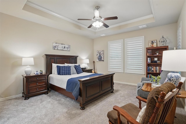 bedroom featuring light colored carpet, visible vents, a raised ceiling, and ornamental molding