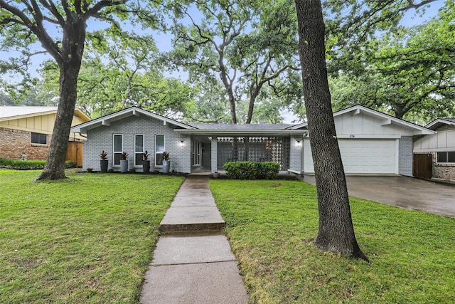 824 Wheelwood Dr, Hurst, TX 76053 - view of front facade with board and batten siding, brick siding, an attached garage, concrete driveway, and a front lawn