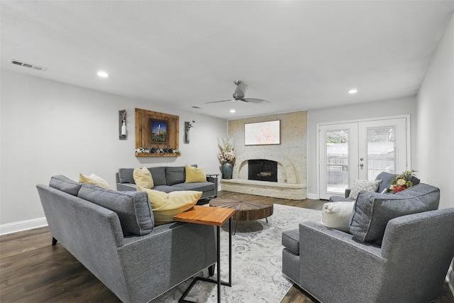 824 Wheelwood Dr, Hurst, TX 76053 - living room with a fireplace, dark wood-style floors, and visible vents