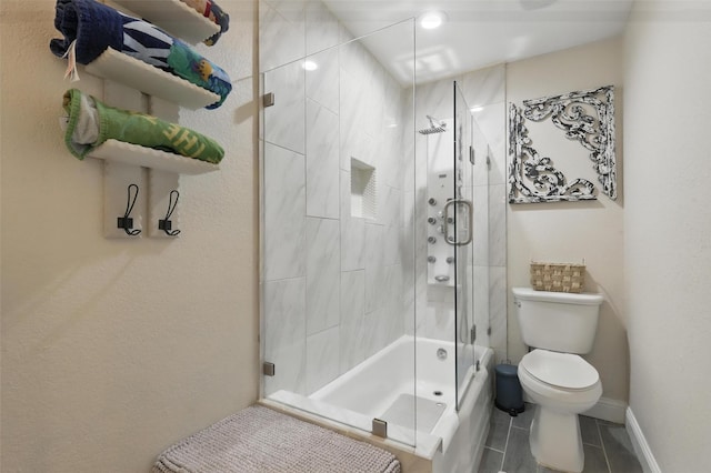 824 Wheelwood Dr, Hurst, TX 76053 - bathroom featuring toilet, tile patterned flooring, baseboards, and shower / bath combination with glass door