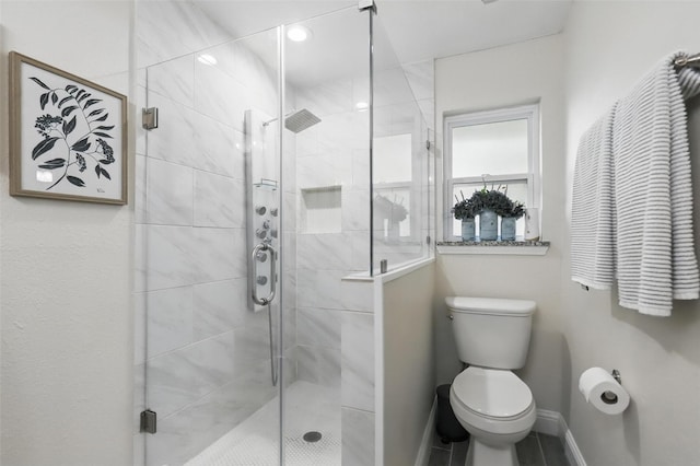 824 Wheelwood Dr, Hurst, TX 76053 - bathroom with toilet, baseboards, and a shower stall
