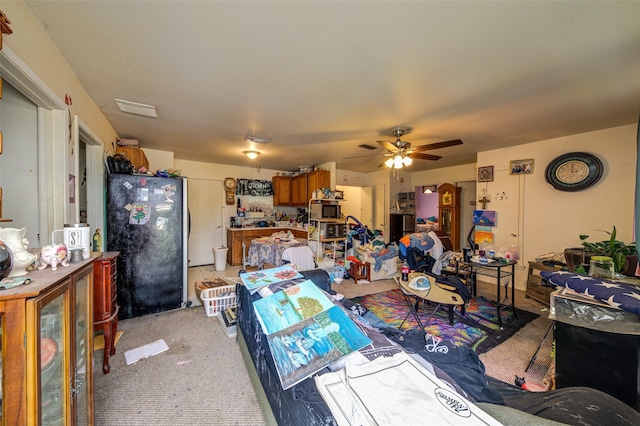 307 W Front St, Sunset, TX 76270 - living area with ceiling fan and light carpet