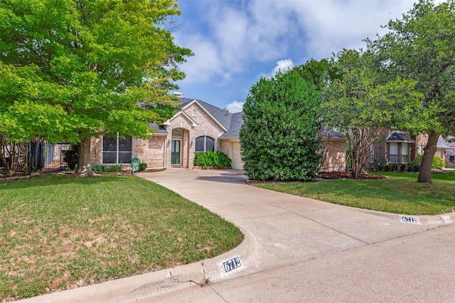 6712 Bluffview Dr, Fort Worth, TX 76132 - view of property hidden behind natural elements featuring brick siding