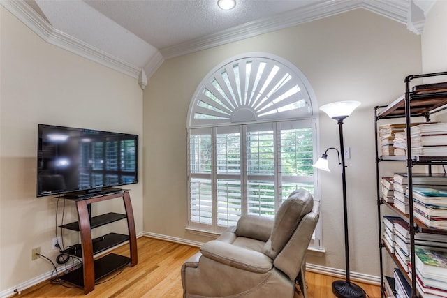 6712 Bluffview Dr, Fort Worth, TX 76132 - sitting room featuring ornamental molding, vaulted ceiling, wood finished floors, and baseboards