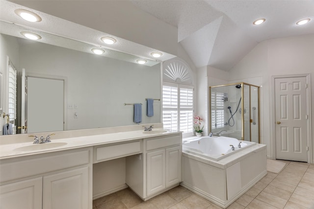 6712 Bluffview Dr, Fort Worth, TX 76132 - bathroom with a stall shower, double vanity, a bath, tile patterned flooring, and lofted ceiling