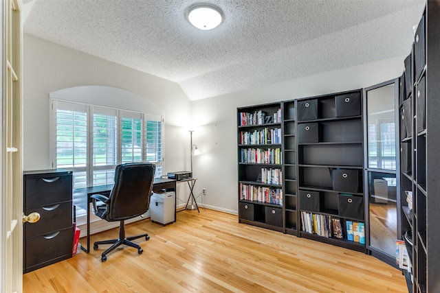 6712 Bluffview Dr, Fort Worth, TX 76132 - office with a textured ceiling, wood finished floors, and lofted ceiling