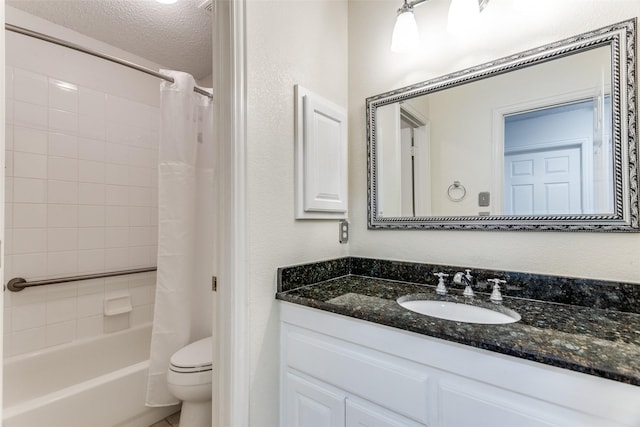 6712 Bluffview Dr, Fort Worth, TX 76132 - full bathroom with vanity, shower / bathtub combination with curtain, toilet, and a textured ceiling