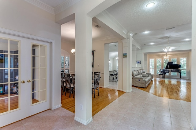 6712 Bluffview Dr, Fort Worth, TX 76132 - hall with french doors, tile patterned floors, crown molding, plenty of natural light, and recessed lighting
