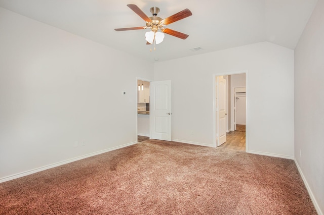 4605 Ashmark Rd, Little Elm, TX 76227 - unfurnished bedroom featuring baseboards, light carpet, a ceiling fan, and a walk in closet
