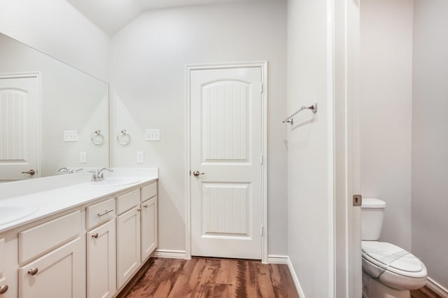 4605 Ashmark Rd, Little Elm, TX 76227 - bathroom with a sink, toilet, baseboards, and wood finished floors